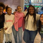 Group of children smiling and posing for photo